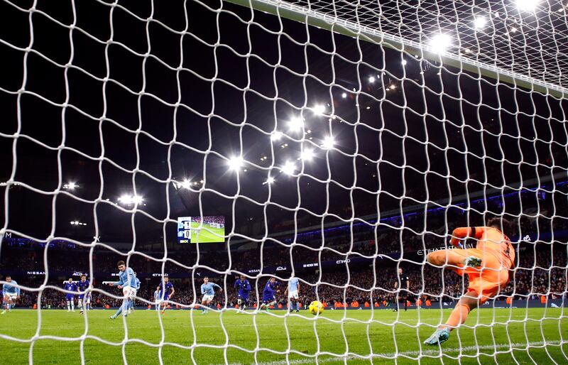 Julian Alvarez scores City's second goal from the penalty spot past Chelsea's Kepa Arrizabalaga. Action Images