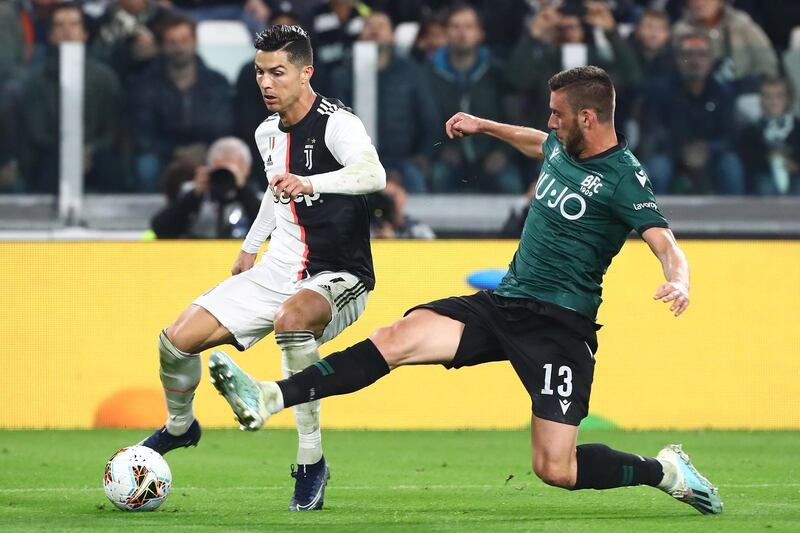 Cristiano Ronaldo of Juventus FC competes for the ball with Mattia Bani of Bologna FC during the Serie A match between Juventus and Bologna FC at Allianz Stadium in Turin, Italy. Getty Images