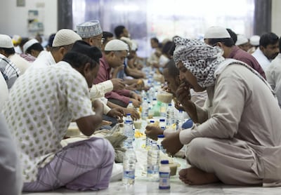 DUBAI, UNITED ARAB EMIRATES, 20 May 2018 - Faithful Muslims doing iftar at Lootah mosque in Deira, Dubai. Leslie Pableo for The National