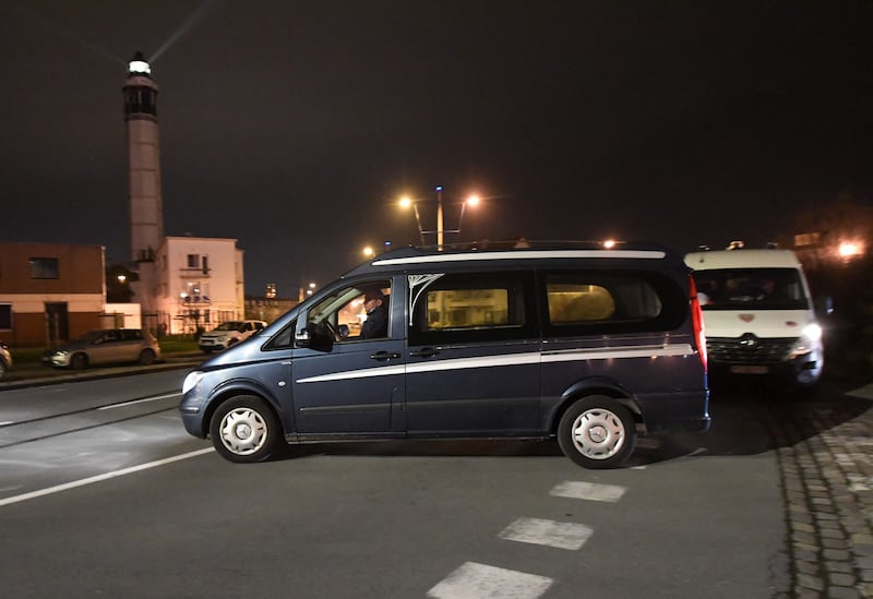 A funeral van leaves the port of Calais. AFP