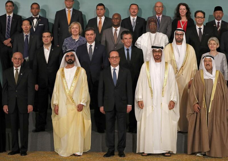 Sheikh Mohammed bin Rashid, Vice President and Ruler of Dubai, and Sheikh Mohammed bin Zayed, Crown Prince of Abu Dhabi and Deputy Supreme Commander of the Armed Forces, with the French president Francois Hollande. Karim Sahib / AFP Photo