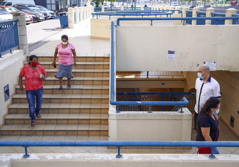 Abu Dhabi, United Arab Emirates, April 6, 2020.   Abu Dhabi residents take the underpass in front of the Al Wahda Mall.  UAE health ministry advised residents to wear a mask when they are outside, whether they are showing symptoms of Covid-19 or not.
 Victor Besa / The National
Section:  NA
Reporter: