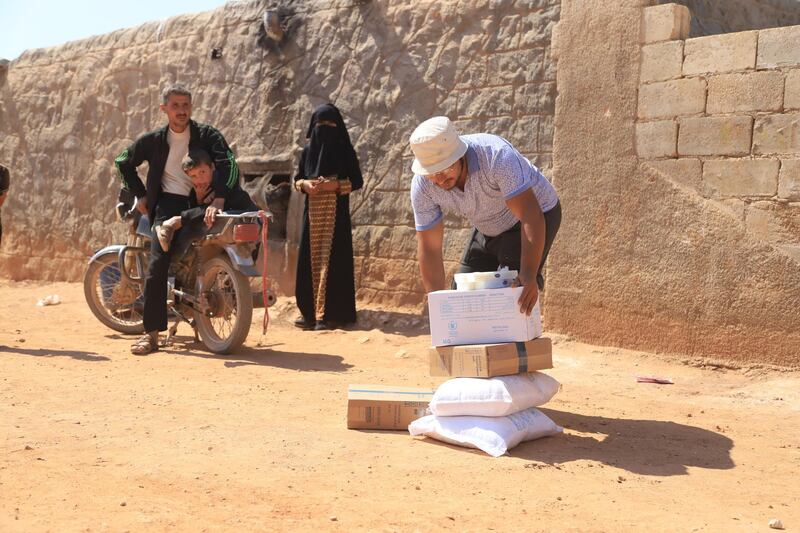 One of the beneficiaries after receiving the food aid.