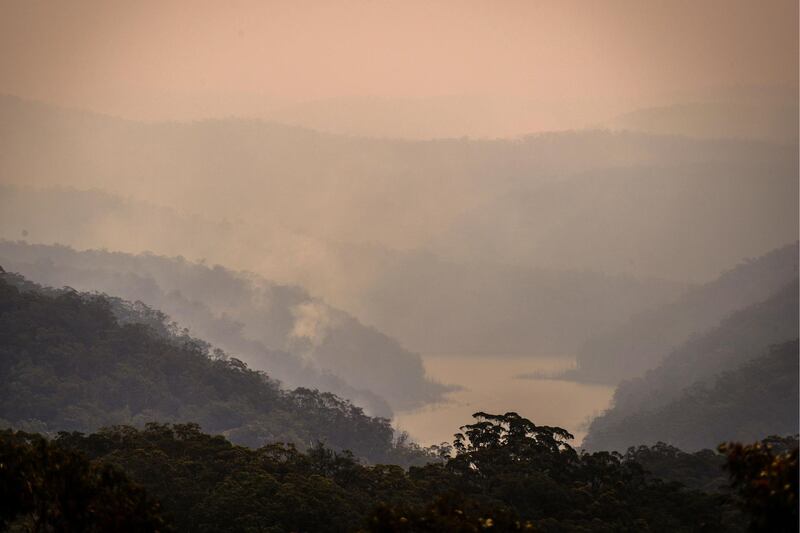 Smoke rises from bushfires in valleys surrounding the Hawkesbury River near the town of Kulnura, New South Wales, Australia. Bloomberg