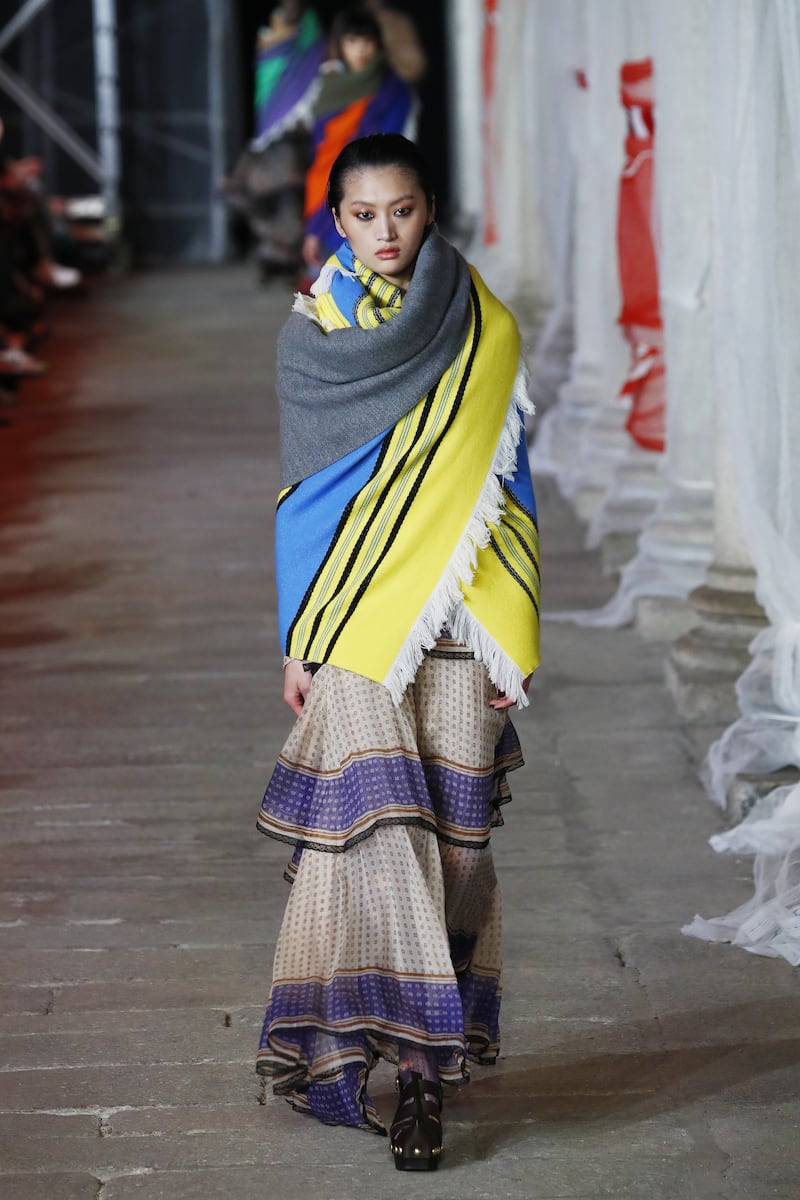 Checked and striped blankets worn as outer layers at Etro.  Getty Images 