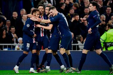 Paris Saint-Germain's Spanish midfielder Pablo Sarabia (third left) celebrates his goal with teammates during the Champions League draw against Real Madrid at the Bernabeu. AFP