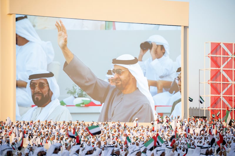 Sheikh Mohamed and Sheikh Tahnoon bin Mohamed, Ruler's Representative in Al Ain Region, seen watching the Union Parade during the Sheikh Zayed Heritage Festival.  
Abdullah Al Junaibi for the Presidential Court