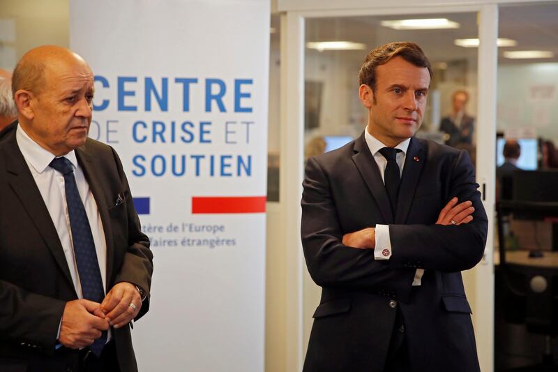 epa08341153 French President Emmanuel Macron, and French Foreign Minister Jean-Yves Le Drian visit the Crisis and Support Center at French Foreign Affairs ministry to give support and repatriation to French citizens abroad at Quai Dâ€™Orsay in Paris, France, 03 April 2020. Macron paid tribute to those who helped more than 130,000 French citizens to return to France since mid-March as countries across the world were closing their borders amid the coronavirus crisis. The new coronavirus causes mild or moderate symptoms for most people, but for some, especially older adults and people with existing health problems, it can cause more severe illness or death.  EPA/Francois Mori / POOL  MAXPPP OUT
