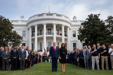US President Donald Trump and First Lady Melania Trump observe a moment of silence on the 18th anniversary of the 9/11 terrorist attacks at the White House in Washington. EPA  