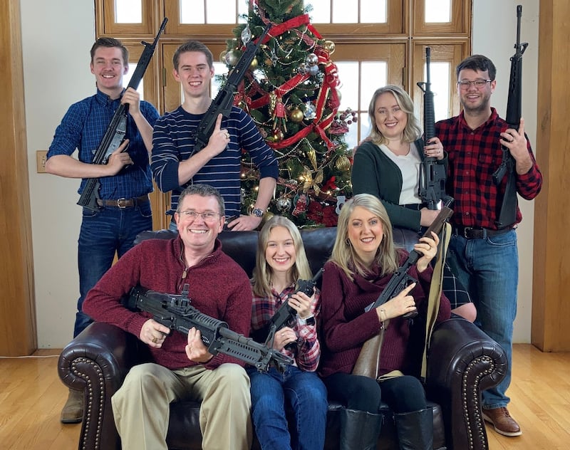 US congressman Thomas Massie in a Christmas photo of his family holding guns. Twitter