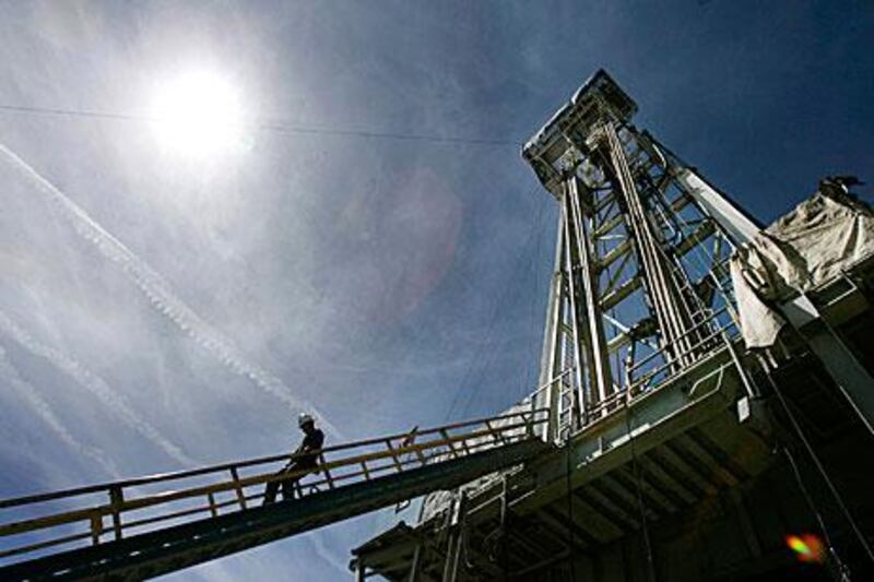 A worker steps down from the drilling platform at the Newberry Crater geothermal project near LaPine, Oregon in 2008.
