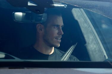Soccer player Gareth Bale looks at fans as he arrives at the training ground of Tottenham Hotspur in London, Friday Sept. 18, 2020. Real Madrid winger Gareth Bale is in London to complete his return to Tottenham. Bale left Tottenham for Madrid in 2013 for 100 million euros. (AP Photo/Frank Augstein)