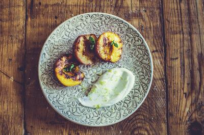 BBQ at home: grilled peaches with whipped cream and lemon. Courtesy Scott Price