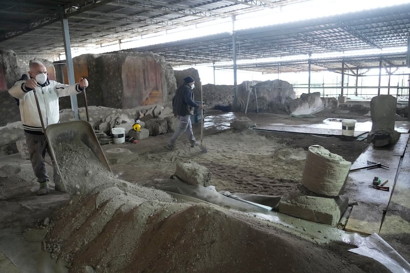 Excavations are carried out inside the 'House of the Library' at Pompeii.