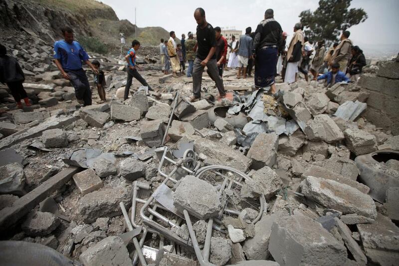 People inspect damage at the site of a Saudi-led coalition air strike in Yemen's capital, Sanaa, on August 11, 2016. Mohamed Al Sayaghi/Reuters