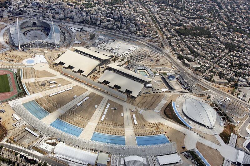 ATHENS, GREECE - JULY 20:  An Aerial view of the Olympic Stadium (L), diving centre (C) pool (2R) and velodrome (R) July 20, 2004 in Athens, Greece. The 2004 summer Olympics will take place in Athens in August. (Photo by Getty Images)