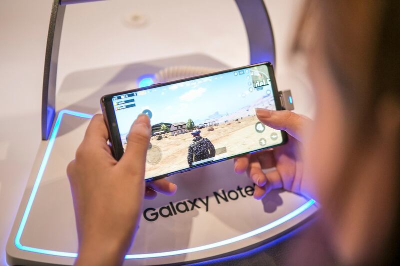 An attendee plays the PlayerUnknown's Battlegrounds (PUBG) game on a Samsung Electronics Co. Galaxy Note 9 smartphone during SK Telecom Co.'s 5GX Game Festival in Goyang, South Korea, on Friday, Aug. 10, 2018. Professional video gaming began in South Korea more than a decade ago, and has given rise to leagues that now pack stadiums and draw hundreds of thousands of eyeballs to Twitch livestreams for tournaments. Photographer: Jean Chung/Bloomberg