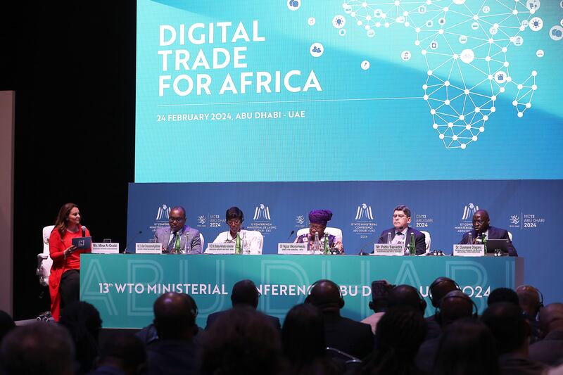 From left, Mina Al-Oraibi, Editor-in-Chief of The National; Jean Ngabitsinze, Rwanda's Minister of Trade and Industry; Shadiya Assouman, Benin's Minister of Industry and Trade; Ngozi Okonjo-Iweala, WTO Director General; and the World Bank's Pablo Saavedra and Ousmane Diagana during a WTO panel discussion in Abu Dhabi. Pawan Singh / The National