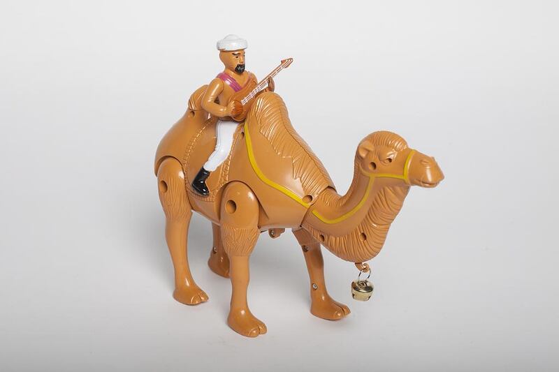 Desert Hero Camel — Dh30

This is similar to Bubble Rider, but without the bubbles and Beverley Hills Cop theme tune. It features a bearded man in a turban and holding a guitar, sitting on his camel. When it is switched on the Desert Hero plays thumping dance music and his camel walks, with the bell on his neck ringing.