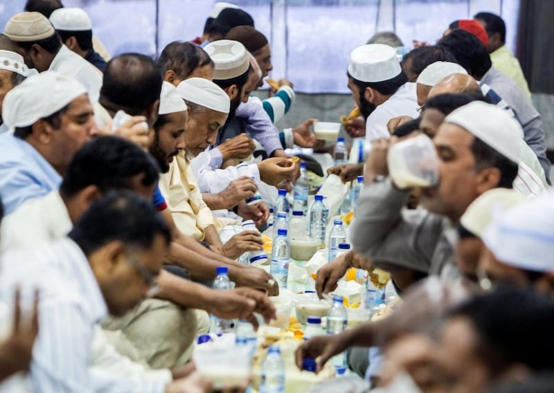 DUBAI,  UNITED ARAB EMIRATES, 20 May 2018 - Muslims during ftar at Lootah Masjid Mosque, Deira, Dubai. Leslie Pableo for The National  for Ramola Talwar story