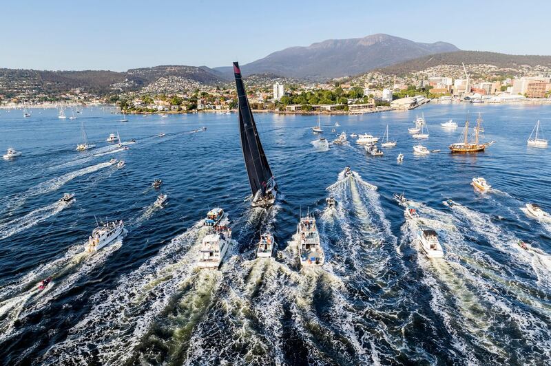 Comanche, centre, surrounded by spectator craft on arrival to Hobart, Australia, to claim victory in the Sydney to Hobart yacht race Saturday, December 28. AP