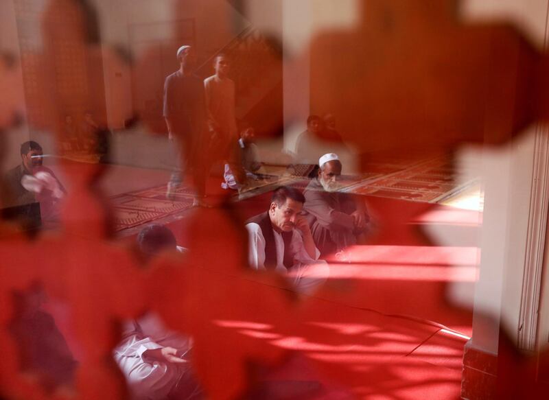Afghan men take part in prayers in Kabul, Afghanistan. Reuters
