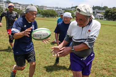 This photo taken on June 28, 2023 shows 85 year old rugby player Yasutake Oshima (R) taking part in a rugby training session for his senior over 70s team, at the Fukasawa Multi-Purpose Sports Plaza in Kamakura, Kanagawa prefecture.  He plays in the Fuwaku rugby club which was created in 1979.  They have different colors of shorts depending on their age: white shorts are for those in their forties, blue for the fifties, red for the sixties, yellow for the seventies, purple for the eighties and gold for the nineties.  It is one of approximately 150 Japanese clubs that stages competitive full-contact matches for players over the age of 40.  Ahead of the Rugby World Cup in France, Agence France-Presse asked aspiring photographers from countries qualified for the competition to show one aspect of the rugby union culture in their homeland, with the help of Canon cameras who are sponsoring the tournament.  From Namibia to Fiji via Romania to Portugal this photo essay gives us a glimpse of the core values of rugby on five continents.  (Photo by KAREN HAIBARA  /  AFP)