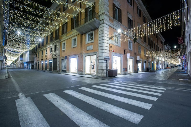 An empty Via del Corso, a shopping street, during curfew hours in Rome. Bloomberg