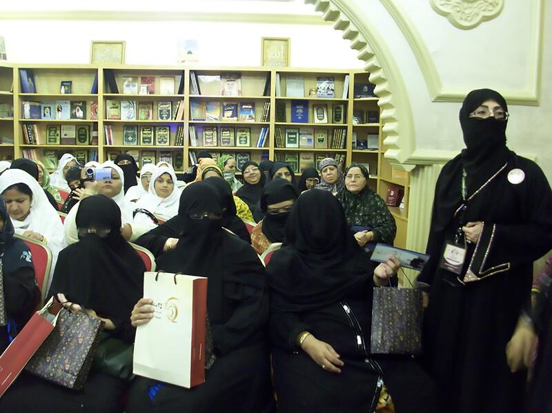 Tour guide Fatin Hussain with a group of pilgrims.