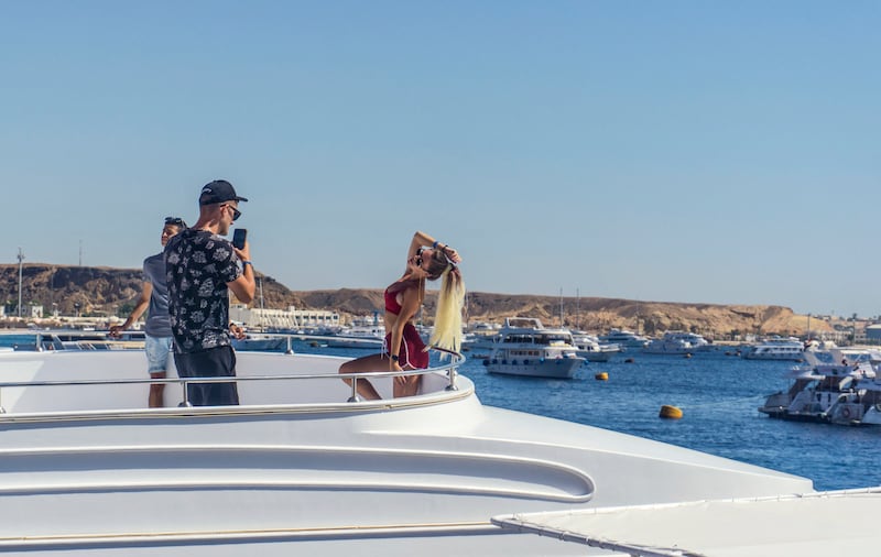 Posing for photographs on yachts is a popular pastime at the resort