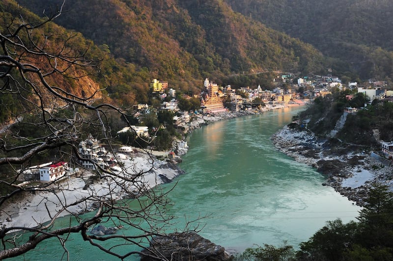 A view of the Ashrams next to the Ganges River at sunset in Rishikesh, Uttarakhand, India. Getty Images