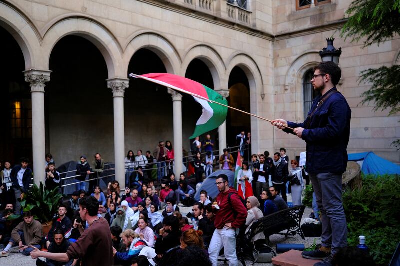 Students gather during an encampment in the cloister of the University of Barcelona. Reuters