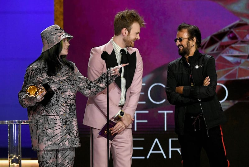 Billie Eilish and Finneas accept the Record of the Year award for 'Everything I Wanted' from Ringo Starr onstage during the 63rd Grammy Awards at Los Angeles Convention Center. AFP
