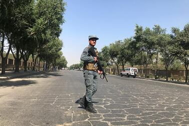 An Afghan policeman keeps watch at the site of a blast near Kabul University in Kabul, Afghanistan July 19, 2019. Reuters