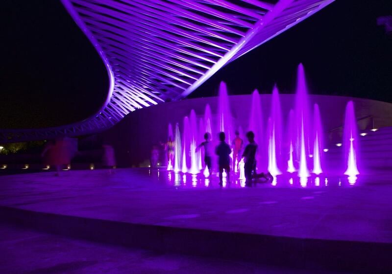 The amphitheatre at Mushrif Central Park is illuminated by pink lights in support of breast cancer awareness month. Vidhyaa for The National