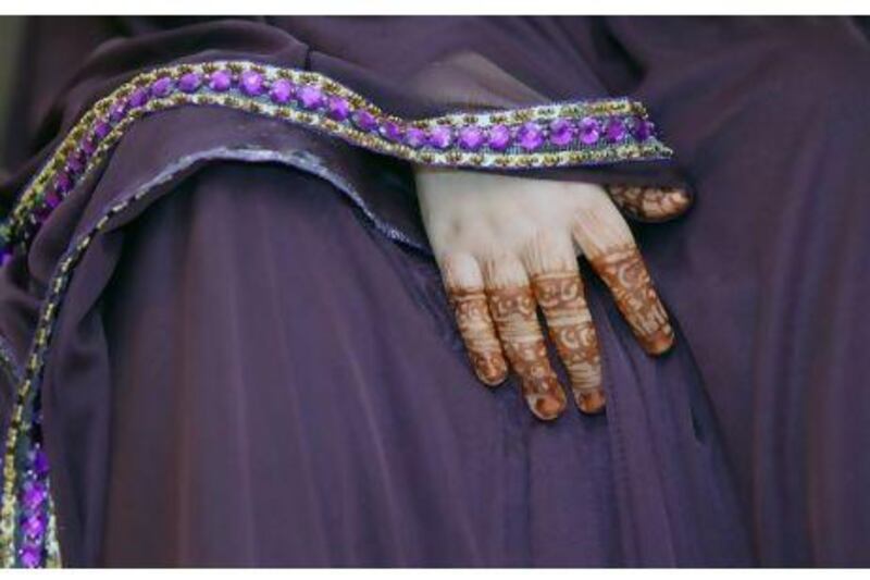 A detail shot of nine-year-old Wafa Salam's henna-painted hands seen while she has her make-up done for a wedding celebration at the Butterfly Salon in Ras Al Khaimah on January 27, 2011.