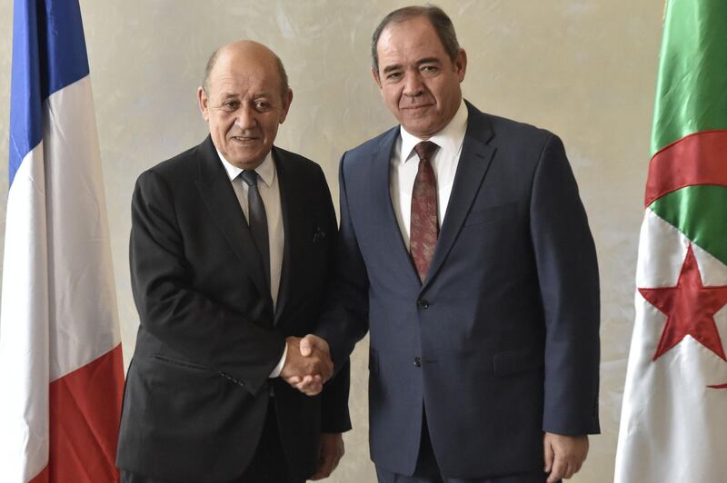 Algerian Foreign Minister Sabri Boukadoum (R) receives his French counterpart Jean-Yves Le Drian in the capital Algiers, on January 21, 2020. Le Drian arrived to Algiers for a brief visit to discuss bilateral and regional issues, starting with the Libyan crisis and the Sahel. / AFP / RYAD KRAMDI                        

