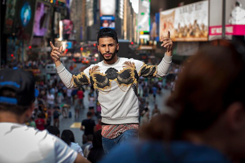 AUGUST 15, 2015 - NEW YORK, NY: Adam Saleh, who has attracted a considerable online following with his YouTube videos, poses for a portrait in Manhattan's Times Square on August 15, 2015. (Dave Sanders for The National) *** Local Caption ***  ds81515-adamsaleh06.jpg