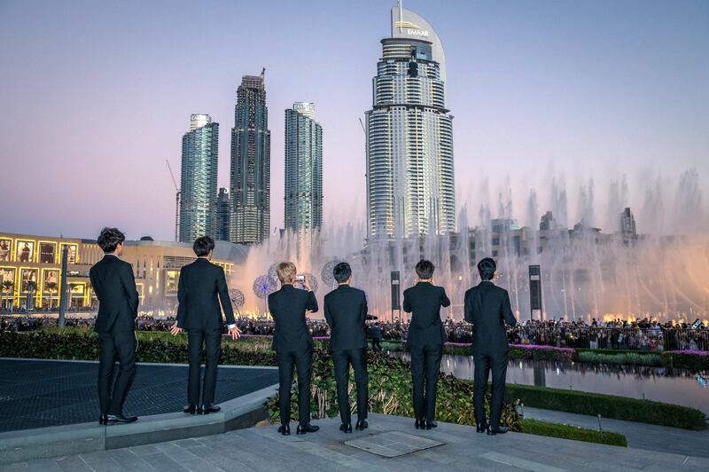 Members of the K-pop boy band Exo watch their song being synced along to the Dubai Fountain. Courtesy Dubai Tourism