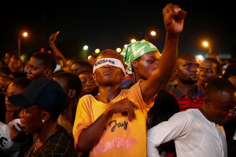 A demonstrator wearing a blindfold with an inscription "End Sars", gestures during a protest against alleged police brutality in Lagos, Nigeria. Reuters