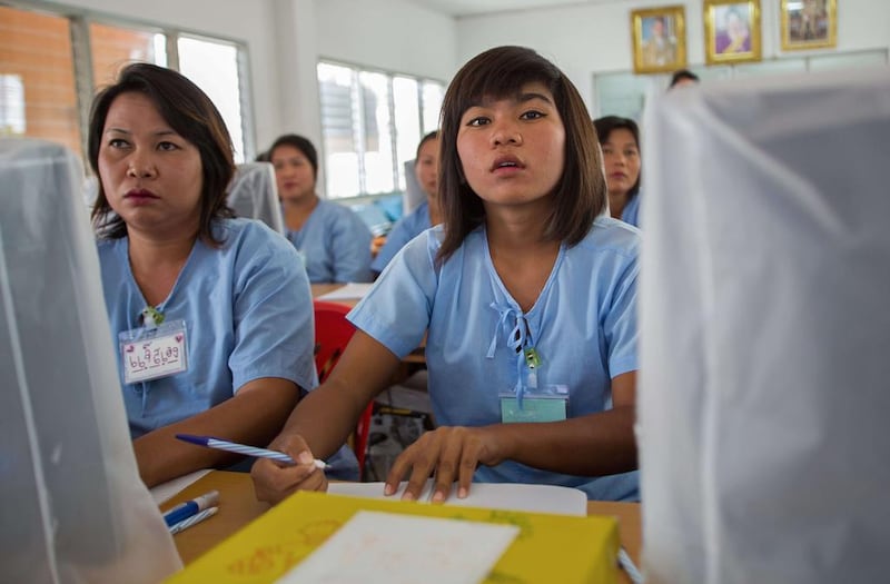 This picture, taken on November 22, 2013, shows Thai female inmates during a writing workshop at a prison in Ayutthaya north of Bangkok. Thousands of women are locked up for drug offences in Thailand, which has one of the world’s highest rates of female imprisonment. William Davies/AFP Photo