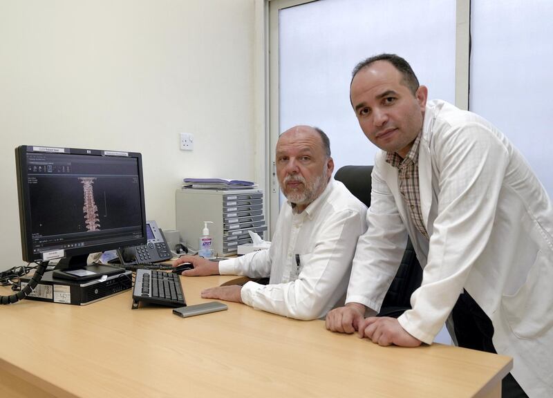 Abu Dhabi, United Arab Emirates, August 20, 2019.  Al Mafraq Hospital doctors.  (R-L)  Dr. Walid Khalifa, Specialist and Dr. Robert Veres, Neurosurgery Consultant.
Victor Besa/The National
Section:  NA
Reporter:  Shireena Al Nowais