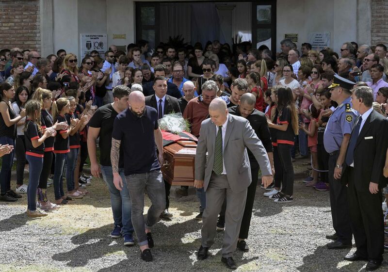 Emialiano Sala's coffin is carried from Club Atletico Deportivo San Martin during the funeral service in Progreso. AFP