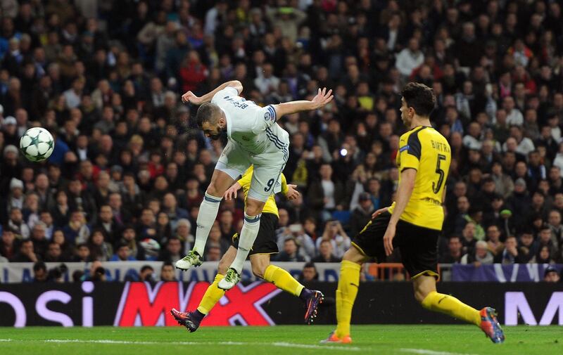 MADRID, SPAIN - DECEMBER 07: Karim Benzema of Real Madrid (C) scores his sides second goal with his head during the UEFA Champions League Group F match between Real Madrid CF and Borussia Dortmund at the Bernabeu on December 7, 2016 in Madrid, Spain.  (Photo by Denis Doyle/Getty Images)