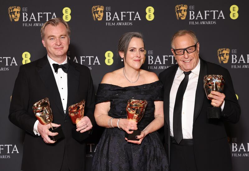 Christopher Nolan, Emma Thomas and Charles Roven after winning the Best Director and Best Film awards for Oppenheimer. EPA