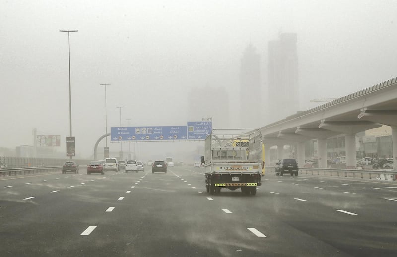 DUBAI , UNITED ARAB EMIRATES , February 03 – 2019 :- Traffic during the dusty and windy weather on Sheikh Zayed road in Dubai. ( Pawan Singh / The National ) For News. 