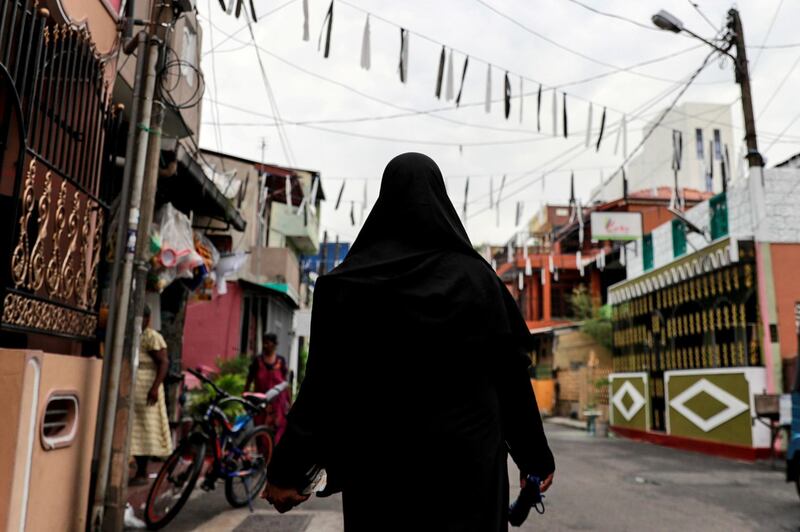 A Muslim woman wearing a hijab walks through a street near St Anthony's Shrine, days after a string of suicide bomb attacks across the island on Easter Sunday, in Colombo, Sri Lanka. Reuters