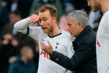 Tottenham Hotspur manager Jose Mourinho, right, does not know if Christian Eriksen will be staying or leaving the club this month. AFP