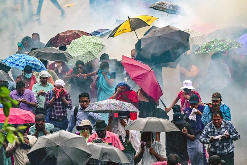Police use water cannons and tear gas to disperse teachers and principals protesting against salary anomalies in Colombo. AFP