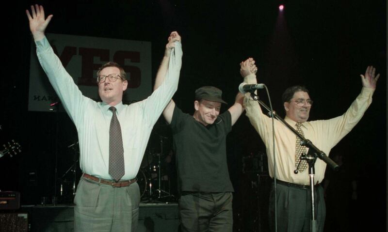 Ulster Unionist leader David Trimble, U2 singer Bono, and SDLP leader John Hume on stage for the 'YES' concert at the Waterfront Hall in Belfast in May 1998. PA